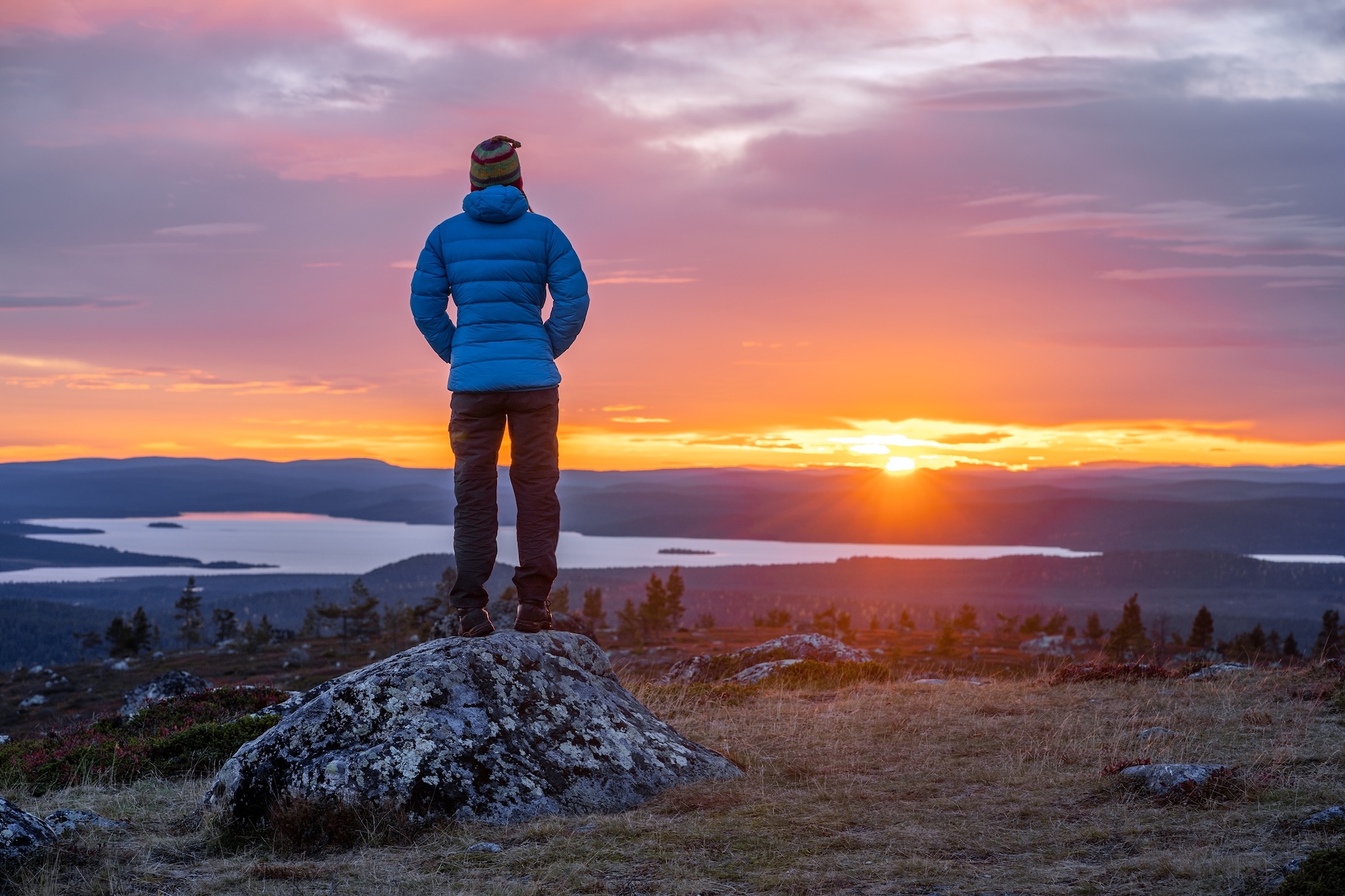 womanlookingatsunsetoutdoorphotolaplandfinland